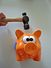 Piggy bank being smashed by Images Money